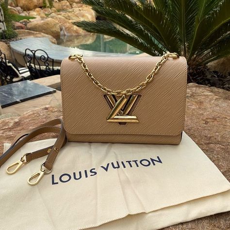 This Is A Stunning Combo ! Hard To Get This Beige And Black Authentic Louis Vuitton Twist Mm Bag Comes With The Original Leather Strap As Well As The Sleeper It Has Been Used Once It Is Literally Brand New Please Review All Photos I Will Not Do Any Holds Or Trades This One Will Go Fast! It’s A Perfect Bag To Use As A Date Night Or You Can Throw The Long Shoulder Strap On And Use It As A Crossbody This Bag Will Go Always With Everything. The Lv Twist Is Done In A Beautiful Gold. Light Scratch S Twist Mm Louis Vuitton, Gold Epsom Leather Bag With Branded Hardware, Gold Epsom Leather Bag For Everyday Luxury, High-end Gold Epsom Leather Bag, Louis Vuitton Handbags Speedy, Real Louis Vuitton, Lv Twist, Louis Vuitton Mm, The Sleeper