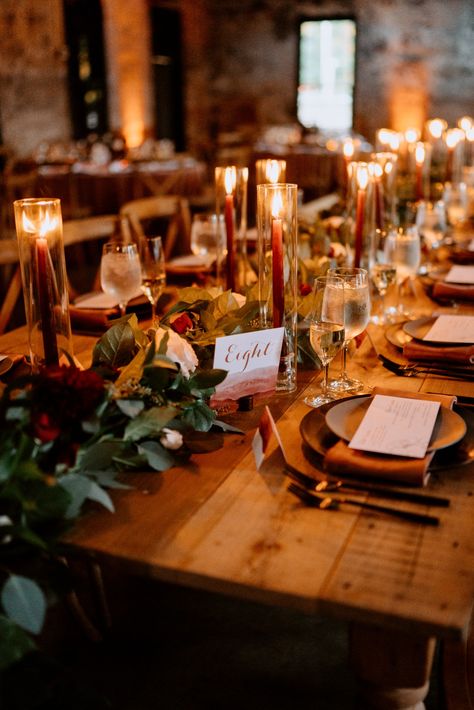 candle lit wedding table // table setting // wedding decor // place settings // candle sticks // burgundy candles // garland // greenery // layered place settings // fall wedding inspo // fall weddings Fall Wedding Farmhouse Table Decor, Wine Wedding Table Setting, Fall Wedding Garland, Fall Minimalist Wedding Decor, Burgundy Candles Wedding, Christmas Wedding Table Settings, Burgundy Table Setting Wedding, Burgundy Wedding Table Setting, Fall Wedding Place Settings