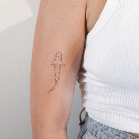 23 Shark Tattoo Ideas and Meanings - 2023 Guide Tiny Hammerhead Shark Tattoo, Men’s Shark Tattoo, Cute Shark Tattoos For Women, Simple Whale Shark Tattoo, Small Whale Shark Tattoo, Small Tattoo Line, Dainty Shark Tattoo, Small Shark Tattoo Simple, Shark Tattoo Fine Line