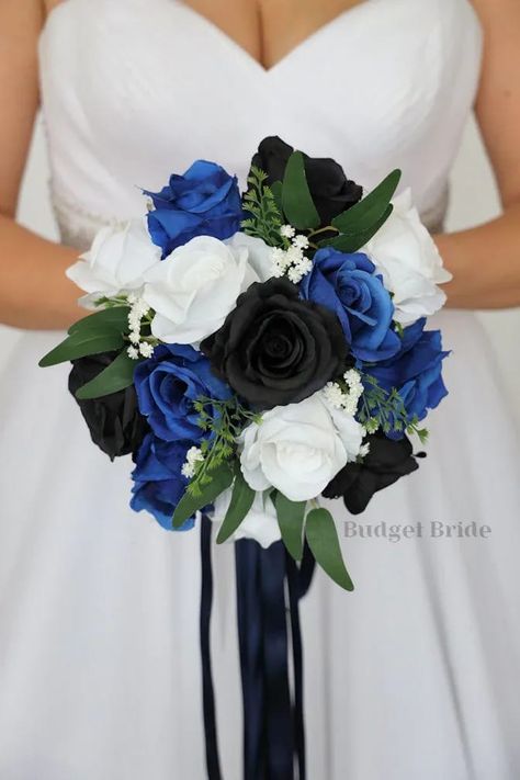 This is a round brides bouquet with white roses, royal blue roses, black roses accented with greenery. All of our wedding bouquets are made with artificial wedding flowers. Bouquet With White Roses, Royal Blue Roses, Ivory Rose Bouquet, Black Wedding Flowers, Wildflower Bouquets, Teardrop Bouquet, Forest Theme Wedding, Round Bouquet, Red Bouquet Wedding