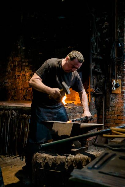 3,353 Blacksmith Forge Photos and Premium High Res Pictures - Getty Images Blacksmith Aesthetic Medieval, Blacksmith Pose Reference, Blacksmith Reference, Blacksmith Aesthetic, Poses For Anatomy, Pose Studies, Architecture Business, Black Smith, Blacksmith Forge