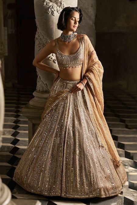 Buy Gold Net Embroidered Mirror Round Bridal Lehenga Set For Women by Seema Gujral Online at Aza Fashions.