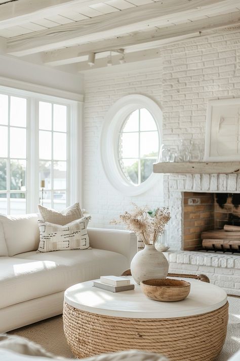 10 Unique Coastal Fireplace Ideas - Casually Coastal Beach Style Fireplaces, Whitewash Brick Fireplace, Coastal Fireplace Ideas, Whitewashed Brick Fireplace, Fireplace Between Windows, Coastal Casual Living Room, White Scandinavian Living Room, Cozy Coastal Living Room, Beach Fireplace