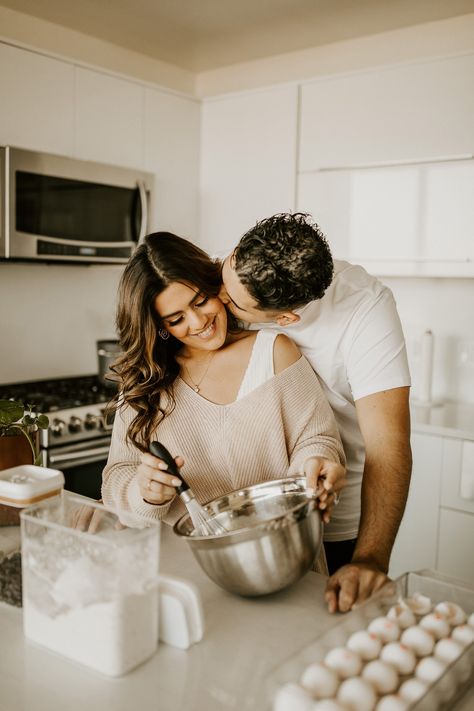 cozy-looking couple mixing ingredients in a bowl in their kitchen Cute Couple In Kitchen, Couple Photoshoot In Kitchen, Cooking Couples Photoshoot, Kitchen Couple Pictures, Couple House Pictures, Christmas Kitchen Photoshoot Couple, Christmas Baking Photoshoot Couple, Engagement Photos Cooking, Baking Couples Photoshoot