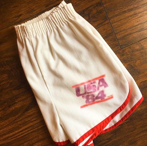 RARE vtg white with red trim gym running shorts!! Vintage 1970's Deadstock, with USA '84 on the bottom. It looks like it was a iron on that eventually over the years got very worn in ! GREAT vintage condition!! 50% cotton 50% polyester Elastic Waist , can be rolled to be shorter Mar Retro Running Outfit, Vintage Athletic Shorts, Vintage Basketball Shorts, Vintage Gym Aesthetic, Vintage Activewear, Track Uniforms, Vintage Athletic Wear, Vintage Gym, Vintage Running