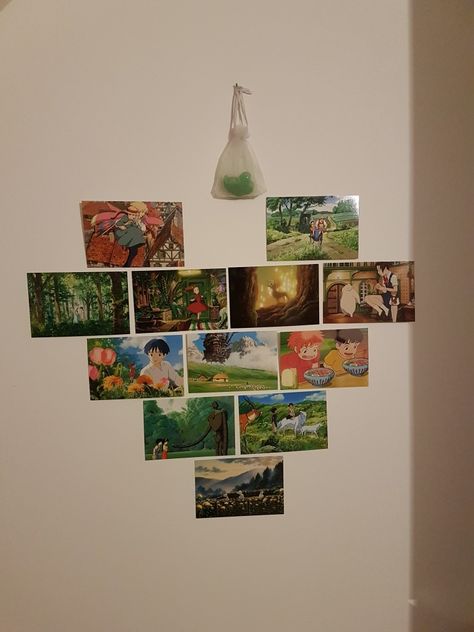 I tried decorating my wall with these cute postcards 🙂 Hanging Postcards On Wall, Ghibli Postcard Wall, Wall Decor Kawaii, Studio Ghibli Postcard Wall, Poster Organization Ideas, Studio Ghibli Postcard, Ghibli Postcard, Study Ghibli, Postcard Wall Decor