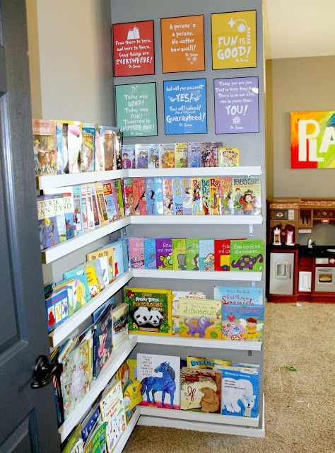 Easy display shelving creates a library-like air in a playroom. | 41 Clever Organizational Ideas For Your Child's Playroom Library Corner, Boys Playroom, Basement Playroom, Childrens Library, Comfy Pillows, Playroom Organization, Kids Room Organization, Salou, Toy Rooms