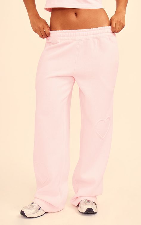 Stay chic and cosy this season in these baby pink heart embossed wide leg joggers. Brought to you in a baby pink hue material with a heart embossed detail and wide leg design, these joggers are calling your name. Pair with the matching top, fresh kicks and your fave headphones for a casual outfit of the day that will turn heads for all the right reasons.   Length approx 78cm/30.5 (Based on a sample size S)   Model wears size S Desired Wardrobe, Shein Finds, Wide Leg Joggers, Shopping Wishlist, Pink Sweats, Ibiza Outfits, Track Pants Women, Pink Joggers, Wide Leg Sweatpants