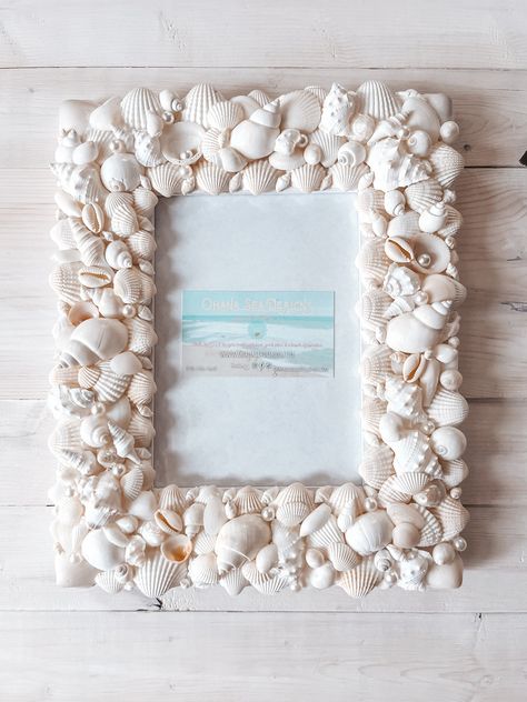 White Shell Picture Frame for 4x6" Photo This seashell frame is designed with beautifully placed natural white seashells, and fits a 4x6" photo. This is for a made-to- order shell frame, so any changes or tweaks can be made if needed. Pearls accents are optional. Industrial strength adhesive is always used so you can be sure your shell design will stand the test of time. This size frame typically takes 2-4 weeks to make from the time of purchase. If you're in a hurry, let me know and I'll be hap Shell Picture Frame Diy, Diy Photo Frame Ideas Creative, Shell Photo Frame, Shell Picture Frame, Shell Photo, Seashell Picture Frames, White Seashells, Wedding Photo Frame, Seashell Frame