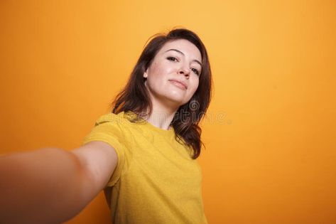 Female influencer taking a selfie stock images Person Taking Selfie, Smile Person, Taking Selfie, Taking A Selfie, Yellow T Shirt, Event Poster, Influencer, Photo Image, Stock Images