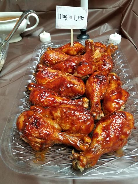 This was easy. BBQ Chicken Legs. I Baked Chicken Legs in the oven, just standard salt, pepper, and bake at 350 degrees, then covered in BBQ sauce. Savory Harry Potter Food, Harry Potter Themed Food Dinner Parties, Harry Potter Birthday Food, Harry Potter Theme Food, Harry Potter Foods, Hogwarts Food, Harry Potter Party Food, Harry Potter Themed Food, Harry Potter Food Ideas