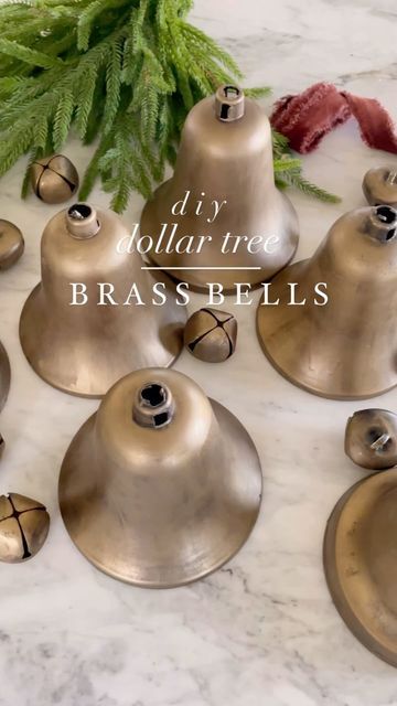 Amelia | Home Decor & DIY on Instagram: "🌲 Want to make your own “brass” bells? This easy tutorial made the perfect brass Christmas bells for our barn door wreaths. I really wanted more bells but didn’t want to spend much money so these plastic bells from @dollartree were perfect once painted. At $1.25 per plastic bell and $1.25 for a pack of 6 metal bells, I knew these would work great! Tutorial: •Plastic bells from dollar tree in varied sizes & packs of gold metal bells. •Spray all the bells with flat black spray paint •Once dry paint all the bells with antique gold rub’n buff •String bells with ribbon, twine or burlap twine Enjoy!! . . . ᴡᴇʟᴄᴏᴍᴇ ᴛᴏ ᴛʜᴇ ᴀᴛ ʜᴏᴍᴇ ᴄᴏʟʟᴇᴄᴛɪᴠᴇ! Here’s How To Join! 1. Follow All Main Hosts and the Community Page: @athomecollectivecommunity @theholl Christmas Brass Bells, Diy Giant Bells, Diy Bell Christmas Ornament, Diy Bell Garland, Diy Christmas Cow Bells, Rustic Bells Decor Christmas Decorations, Christmas Jingle Bells Decorations, Diy Vintage Bells, Diy Jingle Bells