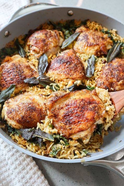 ONE PAN GARLIC AND SAGE CHICKEN THIGHS AND RICE Jen Eats Good, Jenn Lueke, Chicken Thighs And Rice, Sage Chicken, Food Calendar, Sage Recipes, Simple Dinners, Veggie Broth, Budget Friendly Dinner