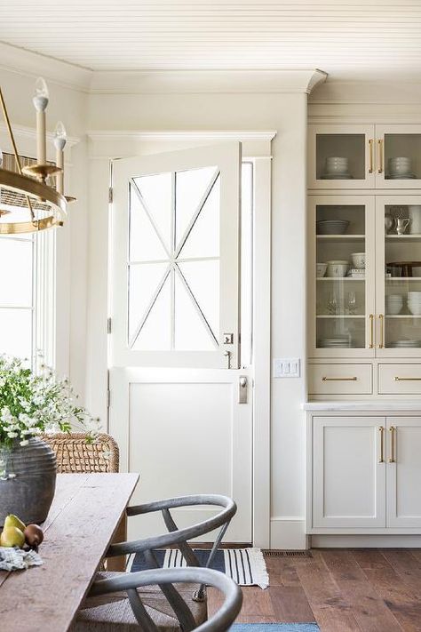 Enhance your kitchen with a dutch door's practical, timeless design. Studio Mcgee Kitchen Cabinets, Mcgee Kitchen, Studio Mcgee Kitchen, Countertop Cabinet, Fixer Upper Style, Estilo Country, Dutch Door, Dining Nook, Studio Mcgee