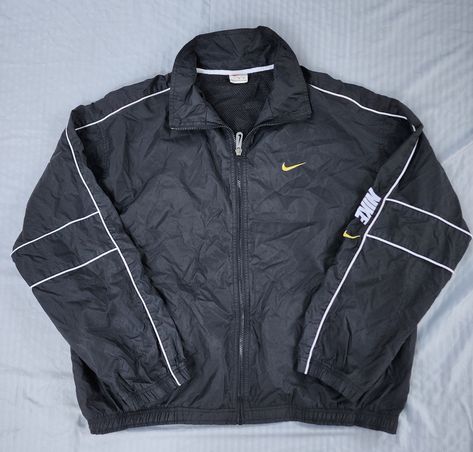 Vintage 1990s Black Yellow Swoosh Nike Windbreaker Jacket  In great condition  Semi Loose Cuffs 9.5/10 XL 27.5 x 28.5 Pit to Pit Any questions feel free to reach out! Nike Windbreaker Jacket, 90s Nike, Nike Windbreaker, Vintage Clothes, Windbreaker Jacket, Black N Yellow, Favorite Outfit, Vintage Style, Vintage Outfits