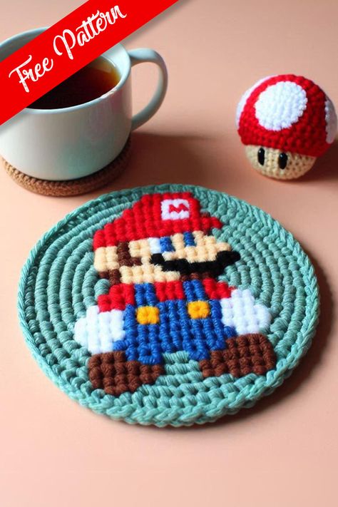 Crochet Mario Coaster Pattern Nintendo Crochet Patterns Free, Crochet Gamer Gifts, Crochet Pattern Coaster, Crochet Gifts For Gamers, Cute Crochet Coasters Free Pattern, Crochet Coaster Ideas, Video Game Crochet Patterns, Home Crochet Projects, Mario Crochet Pattern Free