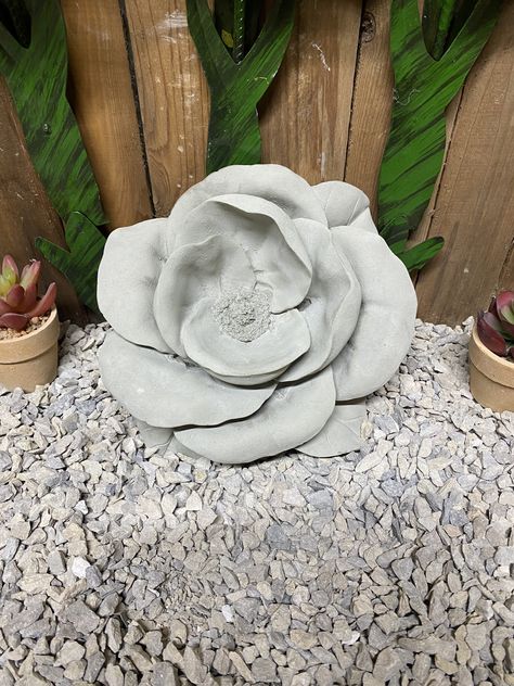 "Rose/ flower -6lbs 6oz -8\"wide x8\" long x 3\" thick -solid concrete made to be outside/ inside year around -shade of the concrete can vary slightly -made with sand, gravel, water, Portland cement and a lot of work -we take pride in our work and produce a high quality product that will last years -some statues will have a seam line from the mold. The seam line or lines aren't considered a defect with the item -some statues will have small air holes. Every statue is different and we do our best Concrete Flowers, Concrete Rose, Concrete Statues, Outdoor Home Decor, Portland Cement, Concrete Crafts, Outdoor Garden Decor, Memorial Garden, Outdoor Home