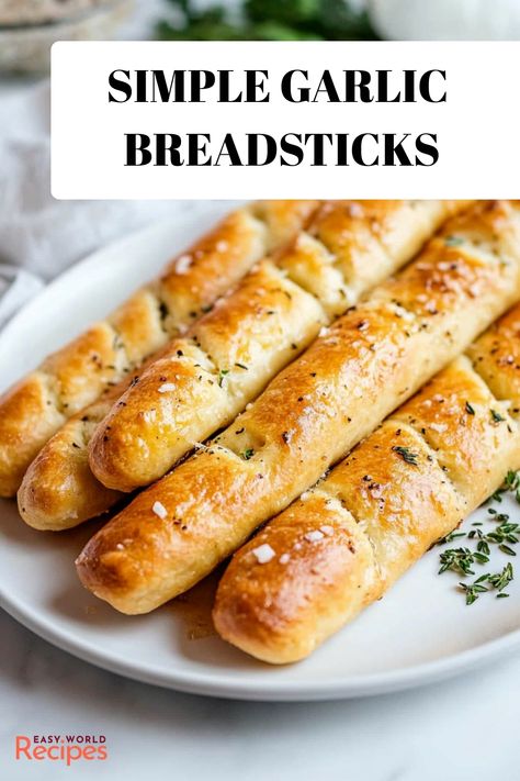 Indulge in the captivating aroma of freshly baked, soft garlic breadsticks that will permeate your space with warmth and comfort. These homemade delights are crafted to perfection, boasting a tender and airy texture that complements the rich flavors of garlic-infused butter. Enhance any meal with this mouthwatering side dish that promises to satisfy cravings and leave a lasting impression on anyone lucky enough to enjoy it. Garlic Breadsticks Recipe, Homemade Garlic Bread Recipe, Italian Snacks, Breadsticks Recipe, Italian Recipes Appetizers, Butter Making, Garlic Rolls, Homemade Garlic Bread, Bread Sticks Recipe