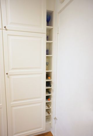 Materials: Billy Bookcase 15 3/4″ by 79 1/2″ white I had an opening of about 6″ in width between my IKEA pantry cabinet and my wall. I took a 15″ wide white Billy Bookcase and cut the back, top, botto Ikea Wine Rack Hack, Ikea Wine Rack Hack Ideas, Gnedby Ikea Ideas, Ikea Gnedby, Ikea Wine Rack, Wine Rack Kitchen, Tall Wine Rack, Expedit Hack, Cabinet For Fridge