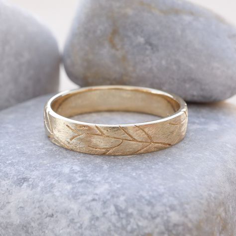 "Make your wedding special with this beautiful tree branch ring. Crafted in textured gold, it has a rustic charm. Ideal for men and women, this small twig ring is inspired by nature, symbolizing strength and growth. The carefully engraved details add a unique touch, making it a perfect choice for couples looking for something special. Celebrate your love with these wedding bands, showcasing the beauty of nature and creating lasting memories on your special day. Measurements: * Material: High Quality Solid Gold 14k or 18k * Ring Width: 4.00 m\"m * Ring Height (Thickness): 1.35 m\"m * Finish: Rustic out - Shiny in ------CUSTOMIZATION------ ♥ Feel free to contact me for any other customization to your preferences. How to order: * Ordering is easy! Just use the Menu Bar to pick the size and go Wedding Ring Nature Inspired, Wedding Ring Man, Nature Inspired Engagement Rings, Tree Branch Ring, Nature Wedding Ring, Twig Wedding Band, Wedding Rings Sets His And Hers, Wedding Bands For Men, Mens Wedding Bands Unique