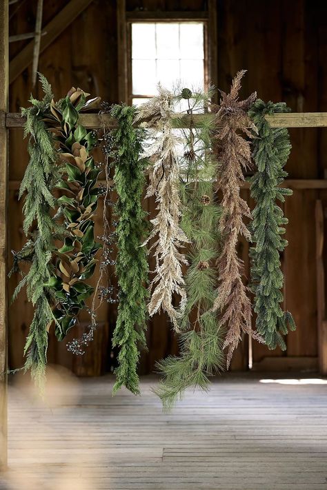 Outdoor Faux Greenery Garland | Anthropologie (US) Faux Greenery Outdoor, Porch Awnings, Faux Cedar Garland, Pine Cone Garland, Cedar Garland, Outdoor Garland, Outdoor Living Furniture, Metal Core, Faux Greenery