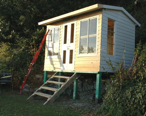 A summerhouse on stilts Shed On Stilts, Small She Shed, Studio Plan, Stilt House, Garden Huts, Writing Room, Shed Office, Aviation Decor, House On Stilts