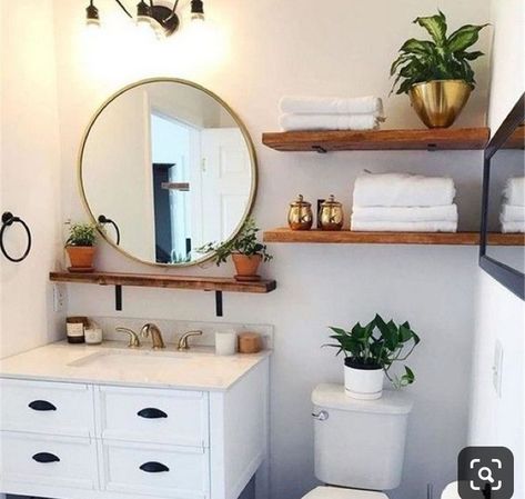 Round Wood Framed Mirror Bathroom, Above Toilet Organization, Boho Bathroom White Vanity, Open Shelving Above Toilet, Tiny Basement Bathroom Ideas, Bathroom Shelf Above Sink, Boho Bathroom Vanity Light, Small Bathroom Setup, Wood Shelves Above Toilet