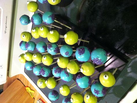 Monsters Inc themed cake pops! Monsters Inc Baby Shower Ideas, Monsters Inc Cake Pops, Monsters Inc Birthday Party Ideas, Monsters Cake, Baby Shower Ideas For Boys Themes, Monster Cake Pops, Monsters Inc Cake, Baby Boy Shower Themes, Monsters Inc Birthday Party