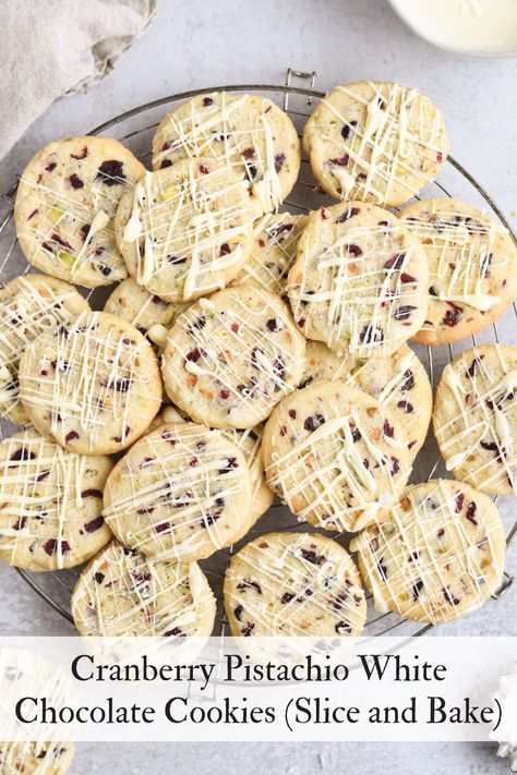 These buttery slice-and-bake Cranberry Pistachio Cookies drizzled with white chocolate are perfect for Christmas cookie exchanges. Cookies Slice And Bake, White Chocolate Cherry Cookies, Lemon Blueberry Bundt, Cranberry Pistachio Cookies, Pistachio White Chocolate, Blueberry Bundt, Blueberry Bundt Cake, Cranberry White Chocolate, White Chocolate Cranberry Cookies