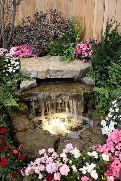 14 Awesome Small Pond Waterfall Ideas! | OutsideModern Small Garden Waterfalls, Pond Decor, Fountain Ideas, Taman Air, Fiberglass Pool, Outdoor Water Features, Garden Waterfall, Pond Waterfall, Pond Water Features