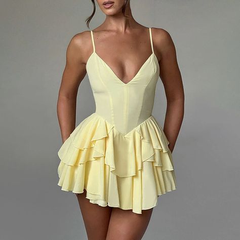 Light yellow playsuit.  
 Lined. 
 Cold hand wash only. 
 True to size. 
 Lightweight, non-stretchy woven fabric. 
 Invisible back zipper. 
 Polyester. 
 
 Ease on down Canary Road with this soft and lovely playsuit. This piece is packed with dainty details making it iconic! This daytime brunch playsuit showcases a frilled hemline to the bottom, a tie feature to the front and a tie to the back.  Pair this dress with strappy heels and soft curls. Backless Slip Dress, Tiered Sleeve, Party Gown Dress, Sleeveless Skirt, Looks Party, Pleated Mini Dress, Backless Mini Dress, Mini Dresses For Women, Ruffle Mini Dress