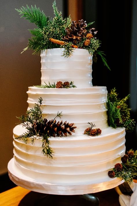 A winter wonderland brought to life with pinecones and greenery on this stunning cake 🎄🍂 | J. Morris Flowers | Floral design studio with a passion for wedding and event decor, everyday floral designs, and floral education. We are located in downtown Leesburg, VA, and service the D.C. metro area and Loudoun County’s wine and hunt country Christmas Theme Wedding Cake, December Wedding Cake, Woodsy Wedding Cake, Winter Wedding Cakes, Christmas Wedding Cake, Winter Flower Arrangements, Christmas Wedding Cakes, Winter Wedding Cake, Woodsy Wedding