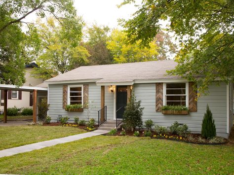 natural wood shutters. doesn't have to have a design like these but I do think it looks cool. and our house is this color. shutter schwing. Light Blue Houses, Ranch House Exterior, Country Ranch, Hgtv Fixer Upper, Gray House, Blue Cottage, Wooden Shutters, Exterior Makeover, Shutters Exterior