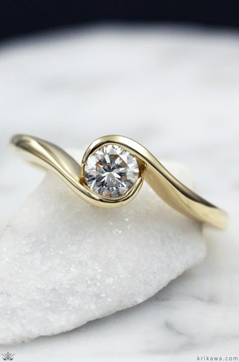 This affordable custom engagement ring gently flows around the diamond like waves on a beach.  What colors do you like?  How about Rose Gold with a Champagne Diamond? Carved Gold Engagement Ring, Single Diamond Gold Ring, Elegant Simple Engagement Rings, Wave Engagement Ring, Single Stone Rings Gold, Stone Ring Design Gold, Modern Ring Settings, Flat Engagement Ring, Flat Engagement Rings