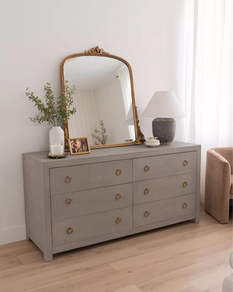 Vintage Gold Mirror Bedroom, How To Decorate Dresser With Mirror, White Dresser Gold Mirror, Vintage Mirror Over Dresser, Brass Bedroom Decor, Grey Dresser Bedroom Ideas, Grey And Gold Furniture, Gold Mirror Dresser, Arch Mirror On Dresser