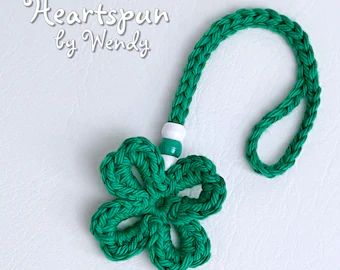 View TOWEL HOLDER PATTERNS by HeartspunByWendy on Etsy Bracelet Bookmark, Shamrock Bracelet, Mirror Ornament, Crochet Keychains, Rear View Mirror Hanger, Crochet Hanging, Crochet Pattern Instructions, Bottle Decoration, Mirror Hangers