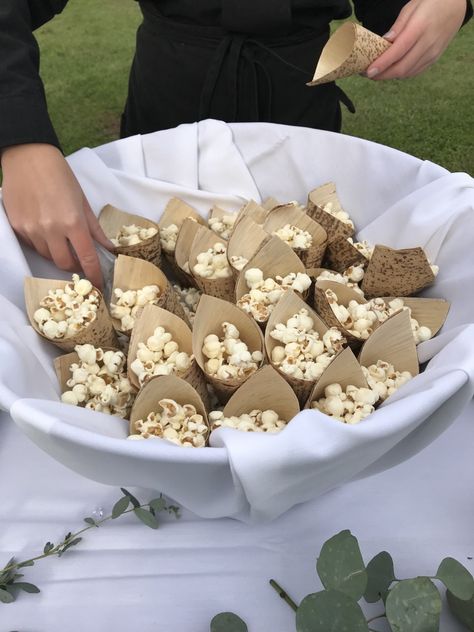 Tempt your wedding guests with popcorn to enjoy while they wait for you to come down the aisle.  #wedding #weddingceremony #popcorn #weddingdetails Popcorn Wedding Ceremony, Wedding Table Snacks Receptions, Pre Ceremony Snacks, Popcorn At Wedding, Savory Wedding Snacks, Wedding Ceremony Snacks, Cheap Cocktail Hour Food, Wedding Snacks Ideas, Wedding Snacks Appetizers