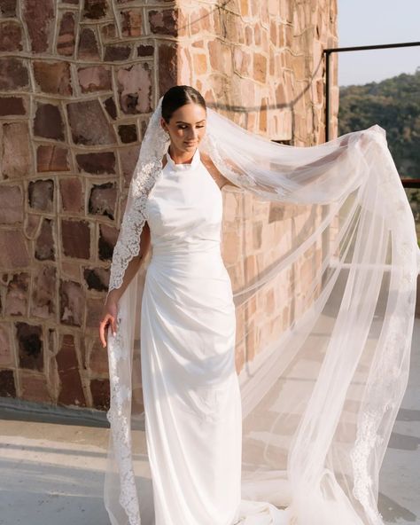 Draped luxury ✨️ How gorgeous are these photos by @skyekyraphotography from a recent styled shoot! This halter neck wedding dress, featuring a hand drapped bodice and skirt, with a low open back and tie detail at the waist. Made from luxurious silky satin, it hangs effortlessly. Perfect for your effortlessly chic aesthetic! Paired with this achrival veil from @veil_atelier and some stunning earrings from @olivecoral. The ever so talented @kiss.the.bride.hair.makeup did this absolutely fl... Halter Neck Wedding Dress, Wedding Dress Veil, Kiss The Bride, Neck Wedding Dress, Chic Aesthetic, Bride Hair, Stunning Earrings, Styled Shoot, Halter Neck