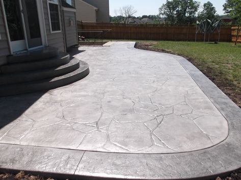 Stamped Patio With Border, Concrete Patio Front Of House, Stamped Concrete Patio With Border, Limestone Stamped Concrete, Raised Stamped Concrete Patio, Outdoor Stamped Concrete Patio, Wrap Around Concrete Patio, Stamped Concrete Flagstone, Stamped Concrete Deck Ideas