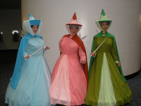 Sleeping Beauty Fairy Godmothers- Flora, Fauna & Merryweather Merryweather Costume, Sleeping Beauty Fairy Godmothers, Fairy Godmother Costume, Sister Costumes, Sleeping Beauty Fairies, Creative Costumes, Disney Cosplay, Disney Costumes, Fairy Godmother