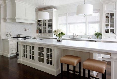 long white kitchen island with built in cabinets and low stools - Decoist Narrow Kitchen Island With Seating, Long Narrow Kitchen, Kitchen With Long Island, Narrow Kitchen Island, Kitchen Island Storage, Bench Seating Kitchen, Decoration Beton, Long Kitchen, Narrow Kitchen