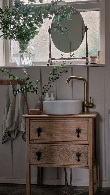 Anita- previously @we_are_the_russells on Instagram: "I've had so many questions about this little unit in the bathroom. Here is how I transformed it from an unloved set of drawers to a wash stand for new bathroom ✨️ TOTAL COST: £180 This includes the unit, the sink, tap, brass waste pipe and plastic u-bend for the sink. As well as the varnish I used to finish it off. We needed a small unit in here but big enough for a bit of storage, so this actually turned out perfect for us. What do you th Small Dresser Sink Vanity, Small Sink And Vanity, Upcycle Sink Vanity, Vintage Wash Stand Sink, Vintage Dresser As Bathroom Vanity, Oval Basin Bathroom, Small Vintage Bathroom Vanity, Chest Of Drawers Sink, Bathroom Sink With Drawers