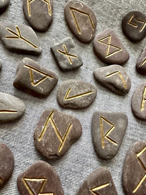 Casting Light on the Mystique of Rune Stones: An Ancient Divination Tradition. Millennium Milli talks about Rune Stones. #runestones #ancienttradition #divination #divinationtools #DivinationJourney #guidence #newage #spirituality #cultures #mythology #vikinghistory #higherself Study Of Ancient Runes Aesthetic, Ancient Runes Aesthetic, Rune Language, Runes Aesthetic, Divination Aesthetic, Stone Runes, Runes Stones, Dnd Aesthetic, Rosemary Candles