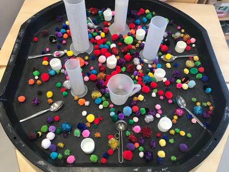 EYFS finger gum - filling measuring jugs with Pom pins using spoons Capacity Activities Eyfs, Eyfs Capacity Activities, Finger Gym Eyfs, Capacity Eyfs Activities, Finger Gym Ideas, Outdoor Psed Activities Eyfs, Funky Fingers Eyfs Motor Skills, Tuft Tray Ideas Eyfs, Tough Tray Ideas Eyfs