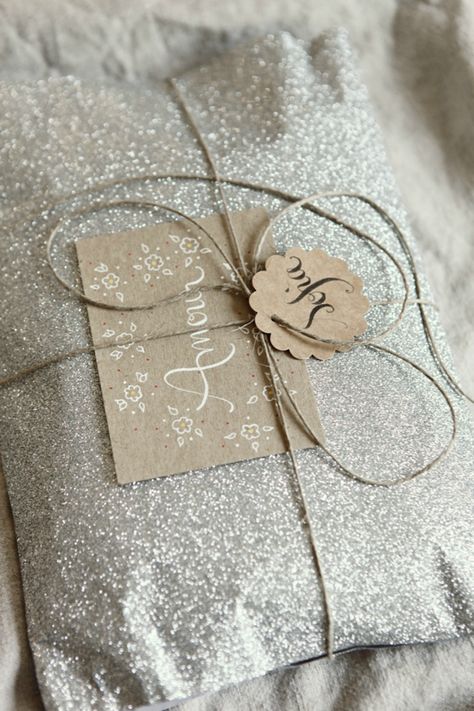 Every girl needs a little sparkle in her life, which is why this perfectly glittered wrapping paper is so fabulous. Tie it all up with some twine and the glamorous girl in your life will think it's almost too pretty to open! Purchase your own glitter wrapping paper here.  - WomansDay.com Creative Wrapping, Gift Wrapping Inspiration, Gift Wrapping Ideas, Simple Packaging, Diy Wrap, Brown Paper Packages, Creative Gift Wrapping, Cadeau Diy, Diy Gift Wrapping