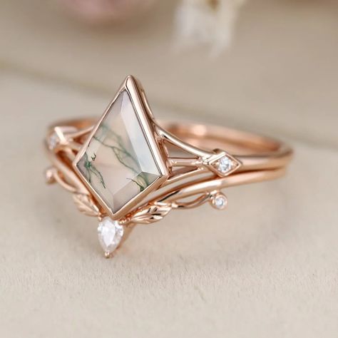 Elevate your bridal style with our Kite cut Natura Moss Agate engagement ring set, crafted in 14k Rose gold and paired with a vintage leaf wedding ring Fairy Wedding Rings, Leaf Wedding Ring, Boho Engagement Ring, Leaf Wedding Rings, Pretty Engagement Rings, Alternative Wedding Rings, Moss Agate Engagement Ring, Cute Engagement Rings, Agate Engagement Ring