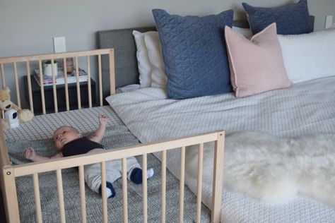 This IKEA hack where I attached a cot (without the side panel) to my bed has been the best idea EVER! I can reach over and feed little P in the middle of the night and it costs a fraction of those bassinets that attach to the side of your bed. It also means when he's big enough, I can just attach the other panel and voila, it's a cot and bassinet in one. Ikea Baby Bed, Ikea Crib Hack, Baby Side Bed, Cosleeping Bedroom, Ikea Cot, Ikea Sniglar Crib, Ikea Crib, Co Sleeper Crib, Ikea Baby