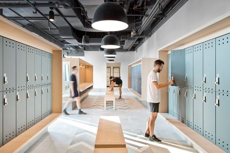 Fogarty Finger Charts a New Course in the Brooklyn Navy Yard With Dock 72 - Interior Design Fogarty Finger, Brooklyn Navy Yard, Locker Designs, Oak Trim, Gym Lockers, Steel Columns, Custom Murals, Changing Room, Gym Design