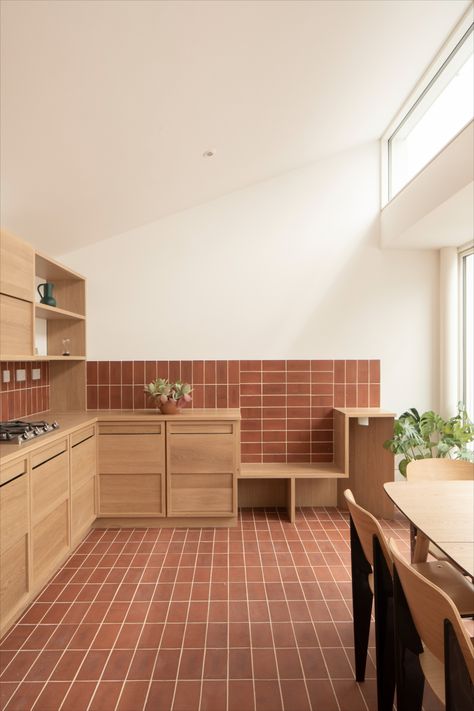 Ketley red quarry tiles, with a vanilla grout. Laid in stack bond on the floor and wall of a kitchen, with smooth wooden kitchen units and wooden kitchen table. Kitchen Flooring Tile, Red Tile Floor, Terracotta Kitchen, Quarry Tiles, Brick Detail, Terracotta Floor, Brick Kitchen, Brick Flooring, Brick Tiles