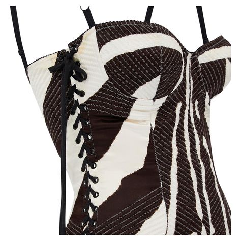 This dress is from Dolce & Gabbana's highly glamorous main line circa 2003. Flaunting many of the fashion house's beloved signature details, we love the underwear-as-outerwear design and sensuous lace-up sides. Tailored from smooth silk with a hint of stretch, it is printed all over with a zebra print design in off-white and darkest brown. The top forms a bustier and is held up by adjustable bra-like straps. The sides of the dress are detailed with black eyelets interwoven with black laces. The Summer 24 Fashion, Black And White Corset, 2024 Fits, Jersey Evening Dress, Silk Corset, Dolce And Gabbana Handbags, Oc Outfits, New Look Fashion, Zebra Print Dress